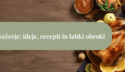 Pečen piščanec na krožniku z limono, zelenjavo in jesenskimi dodatki na leseni mizi – predstavitev zdrave večerje.